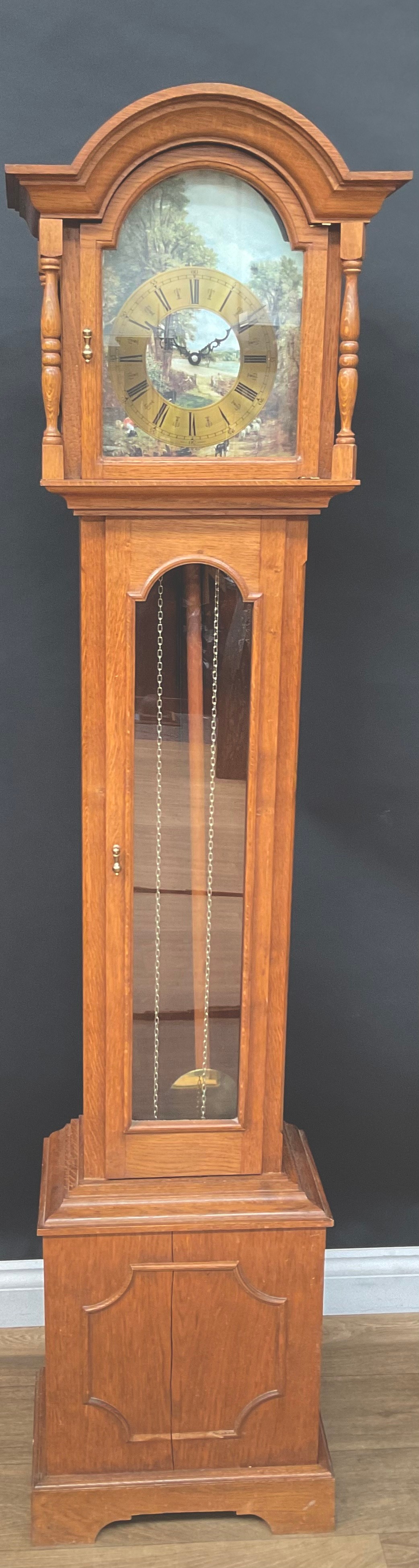 An oak short case hall clock, brass twin weights, 188.5cm high