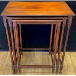 A George III Revival mahogany nest of three occasional tables, the largest 63cm high, 54cm wide,