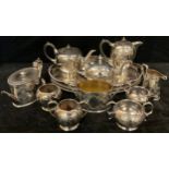 A late 19th century EPNS three piece oval tea service, engraved with trailing ivy, number 6989;