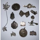 Silver brooches, charms and pendants, 19th century and later