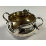 An Asprey of London George V silver pap boat, two handled with pair of pouring spouts, 10cm wide,