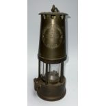 An Eccles Type 6 miner's brass safety lamp