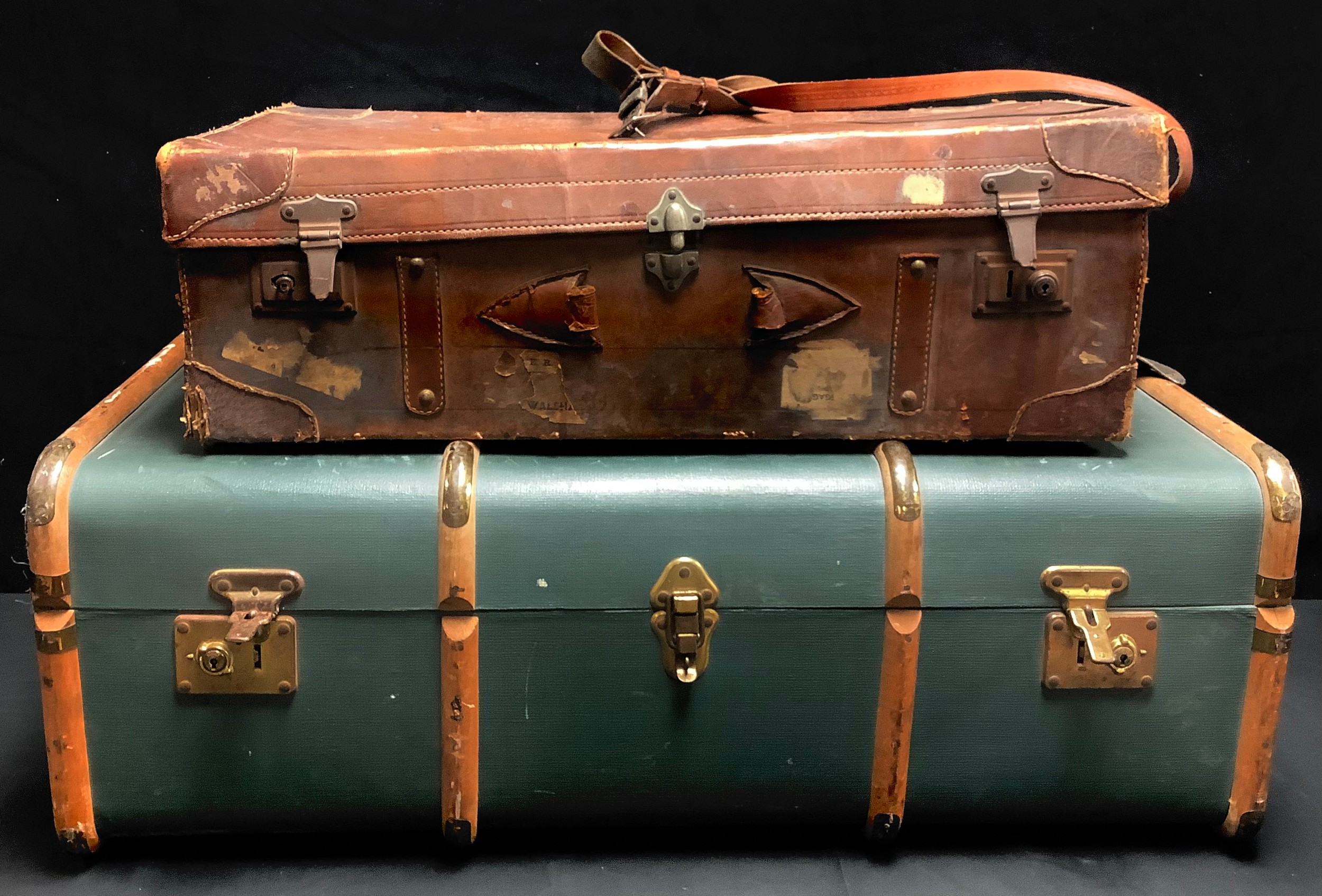 A steamer trunk, with assorted Cunard Line stickers; a brown leather case (2)