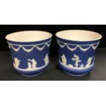 A pair of Adams Tunstall Jasperware jardinieres, typically sprigged with classical muses in a