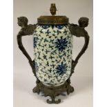 A large bronzed metal mounted table lamp, painted in the Chinese taste in underglaze blue with