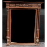 A 19th century rectangular looking glass, the oak frame with freestanding pilasters, bevelled mirror
