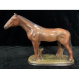A Staffordshire model of a bay horse, 37cm high, 48cm wide