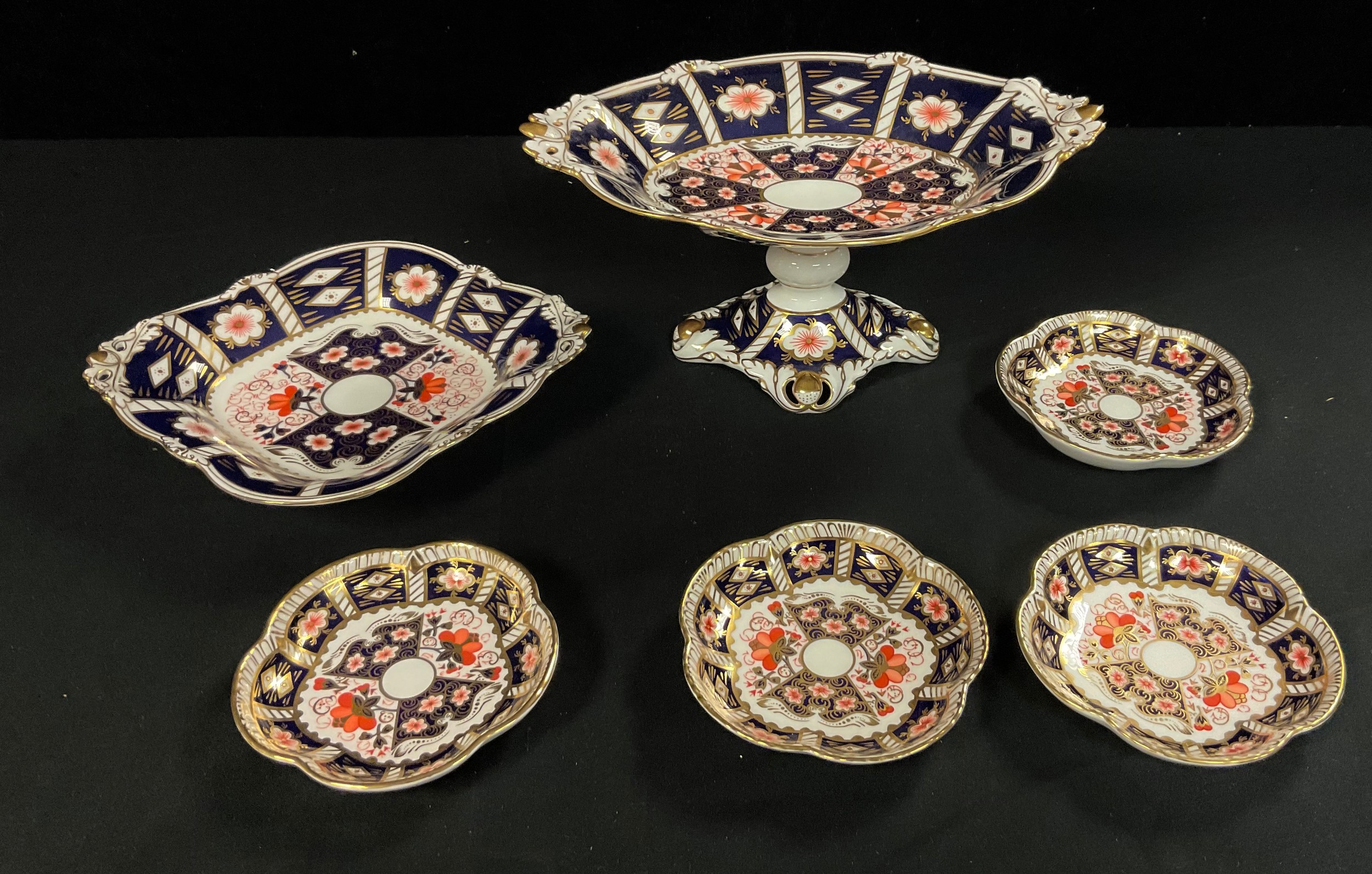A Royal Crown Derby Imari 2451 pattern pedestal shaped oval comport, pair of acorn handles,