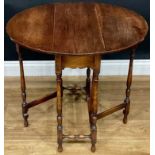 An early 20th century oak spider leg table, c.1920, 64.5cm high, 25cm extending to 68cm long, 61cm