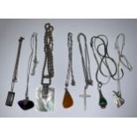 A collection of silver and silver coloured metal neck chains, various pendants including amber,