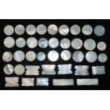 A collection of thirty-nine 19th century Cantonese mother of pearl gaming tokens of various shapes