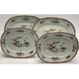 A set of four 19th century Minton & Hollins ironstone shaped oval serving platters, decorated with