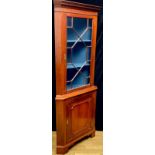 A George III design mahogany floor standing corner display cabinet