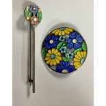 A silver pierced circular brooch, enamelled with bright yellow and blue flowers, 3.5cm, AH Darby &