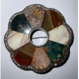 A large Scottish silver brooch set with agate specimens, 5.5cm wide