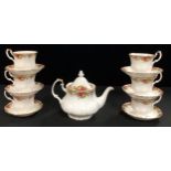 A Royal Albert Old Country Roses Ruby Celebration pattern tea set, comprising medium teapot, six