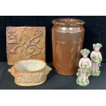 A Derbyshire salt glazed oval butter dish, lion mask handles, 14cm wide; a salt glazed jar and tile;