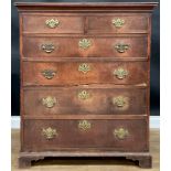 A George III Revival oak chest, of two short and four long graduated drawers, skirted base,