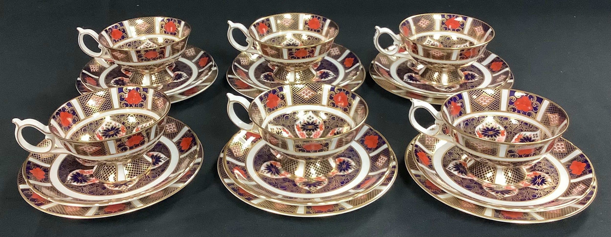 A set of six Royal Crown Derby Imari 1128 pattern teacups, saucers and tea plates, first quality,