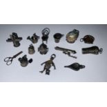 A collection of fourteen 19th century and later silver charms