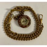 A Victorian gilt metal double Albert chain, with serpentine compass fob, 36cm long