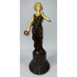 A large bronzed metal figure, as an Art Deco lady, on composite marble base, 42cm high
