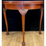 A George II Revival walnut card table, 74cm high, 79cm diameter, c.1925