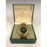 Gucci - 3300.2.M gold plated dress wristwatch, 32mm case, black dial, gold hands, Roman numeral
