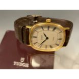 Rolex Tudor - Geneve Quartz wristwatch, oblong gold plated case, textured dial, black hands, Roman