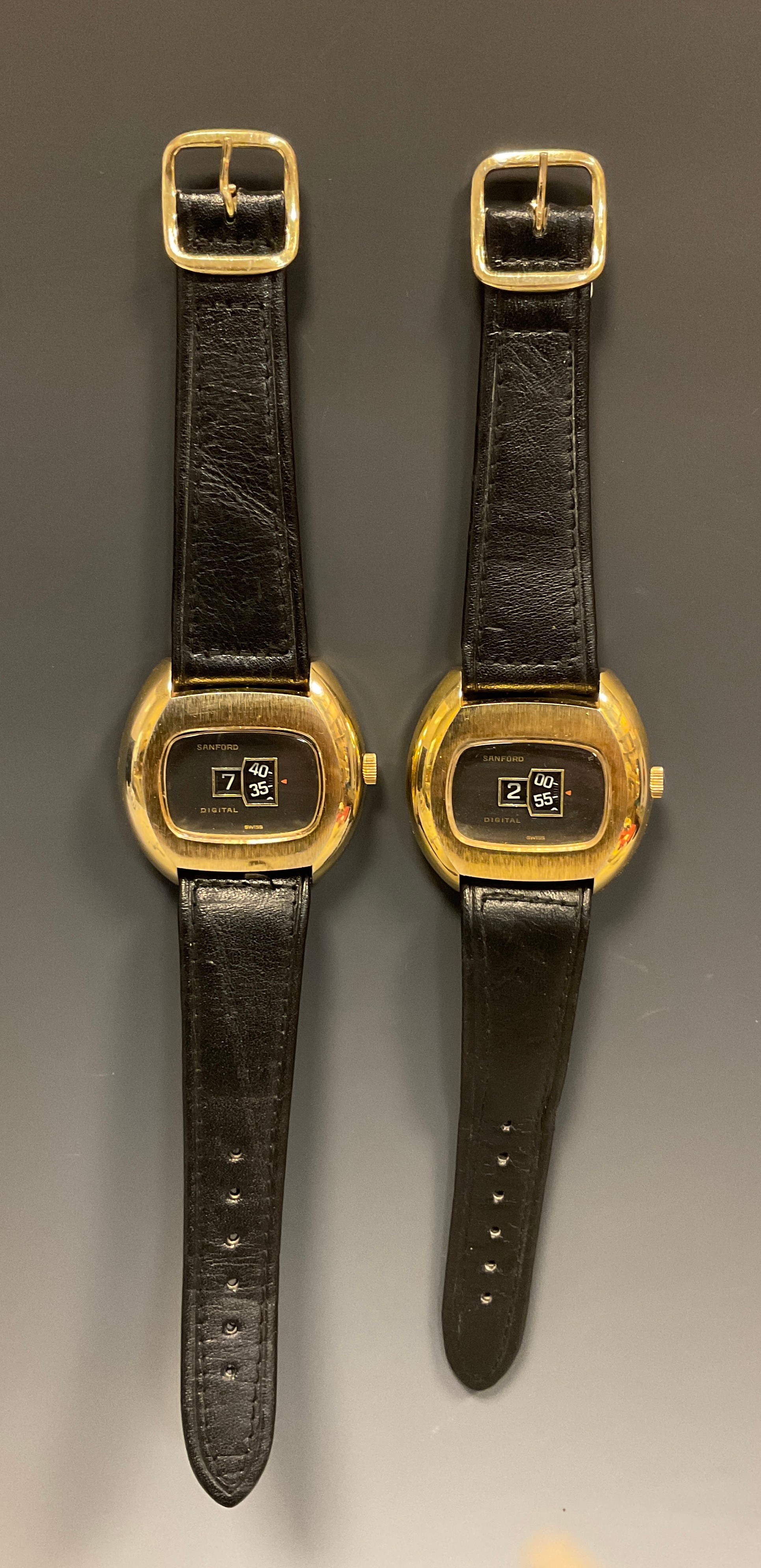 Sanford - two digital jump hour 1970s wristwatches, brushed gilt metal cases, graphite grey