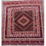 A late 19th century Persian/Turkish Souf rug, field panel with central medallion within stripped