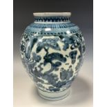 A 17th century Japanese ovoid vase, painted in tones of underglaze blue in the Chinese taste with