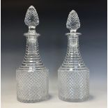 A pair of 19th century hobnail-cut decanters, pointed stoppers, stepped necks and shoulders, star-