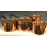 A set of four 19th century copper copper country house kitchen saucepans and covers, iron handles,