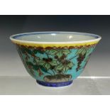 A Chinese Cloisonné on Porcelain tea bowl, decorated with fruiting vines and laburnum on a turquoise