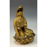 A Sino Tibet bronze figure, as Guan Yin seated on a lotus flower base, unmarked, 17cm high, 11cm