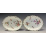 A pair of 18th century Chelsea Derby oval dishes, each painted with English flowers within moulded