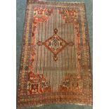 A Persian hand-knotted Khamseh rug, branched diamond-shaped medallion within a field of