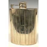 An Art Deco style silver curved rounded rectangular hip flask, engine turned in bands, hinged