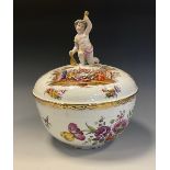 A Berlin circular tureen and cover, painted in polychrome with genre scenes and Deutsche Blumen,