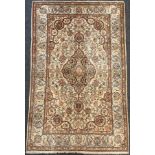 A Persian Kashan rug / carpet, wool and silk mix, knotted with Navette-shaped medallion, within a