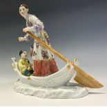 A Meissen figure group, of a woman and young boy in a fishing boat, 15cm high, impressed numbers,