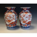 A pair of Japanese ovoid vase, painted in the Imari palette, with birds amongst branches, 25cm high,