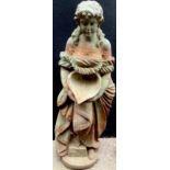 A 19th century cast iron garden statue, of a lady holding a shell, circular base, 105cm high