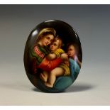 A Continental porcelain oval plaque, painted after Raphael with the Madonna della Seggiola, 8.5cm
