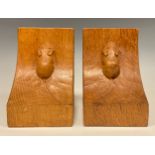 Mouseman of Kilburn - a pair of oak book ends, adzed overall, carved mouse signatures, each 15.5cm