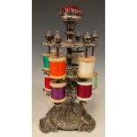 Sewing - a 19th century Rococo Revival silver plated two-tier revolving cotton reel stand, pin