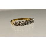 A diamond ring, linear set with seven round brilliant cut diamonds, total estimated diamond weight