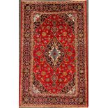 A Central Persian Kashan rug, hand-knotted with navette-shaped medallion, within a field of