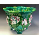 A Minton majolica jardiniere, moulded with water lilies and glazed in tones of green, pink and